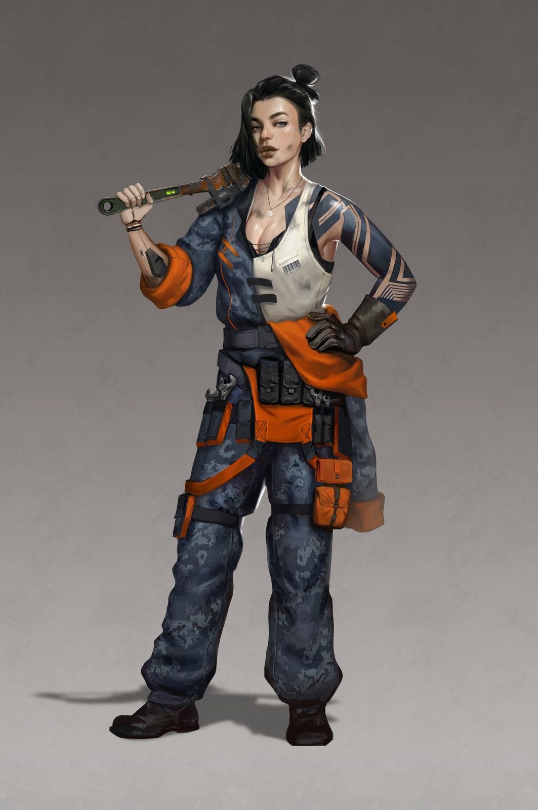 A tattoo'd woman with black hair and coveralls holding a large wrench